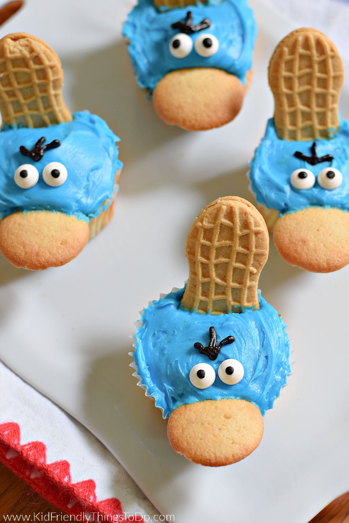 These Simple Perry the Platypus Cupcakes are bound to be a hit with Phineas and Ferb fans of all ages. With a an easy cupcake base, a Nutter Butter tail, Vanilla Wafer beak, and candy eyes, this treat brings everyone's platypus secret agent to life in a fun and delicious way.