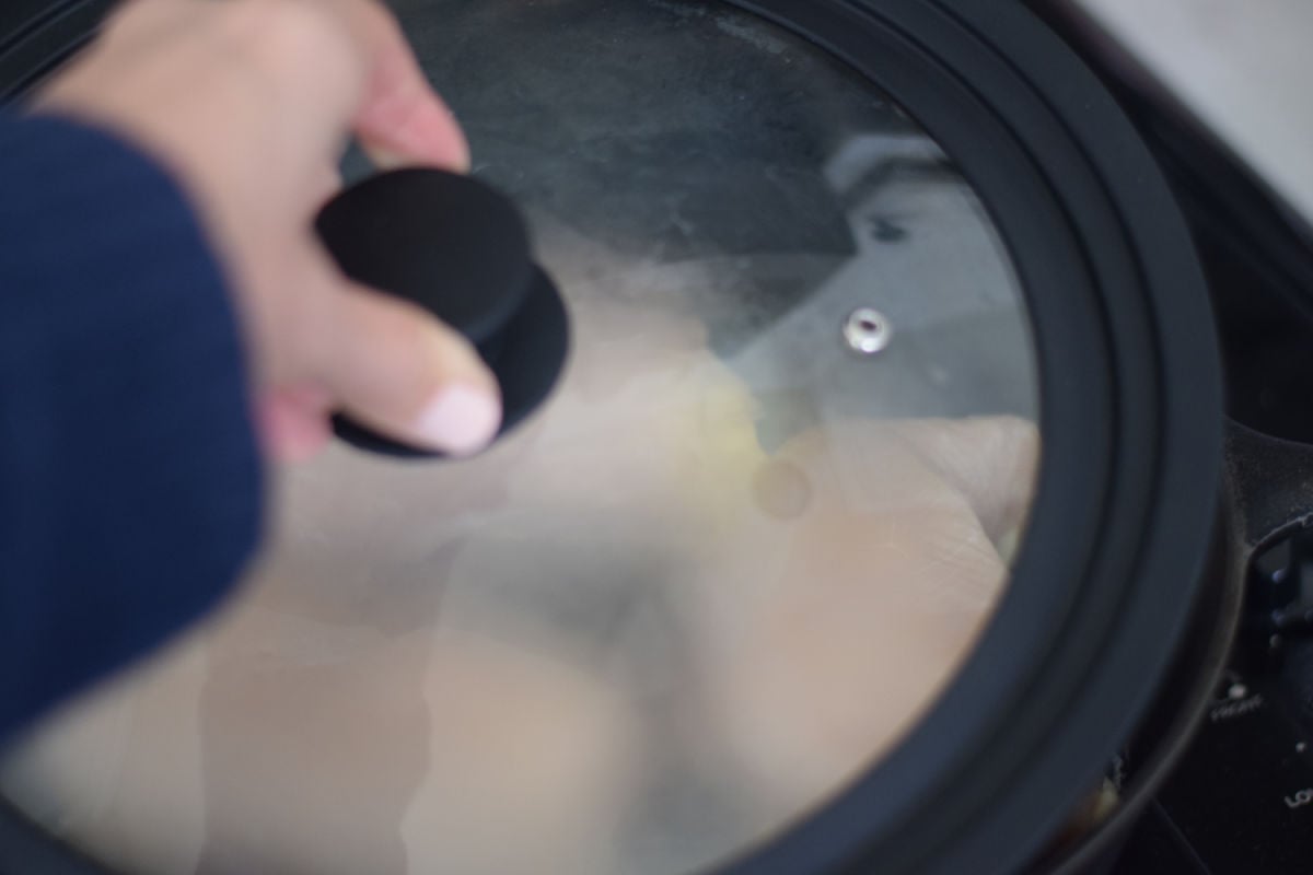 adding lid to skillet