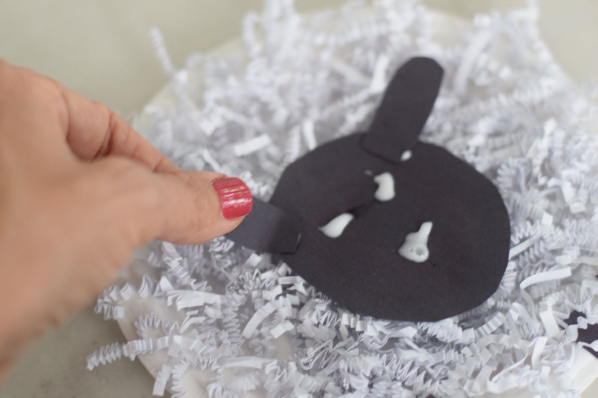 adding face to paper plate sheep craft