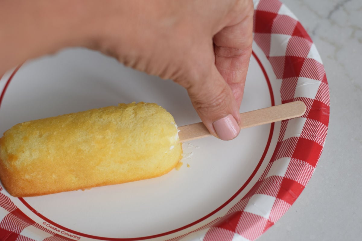 pushing a stick into Twinkie