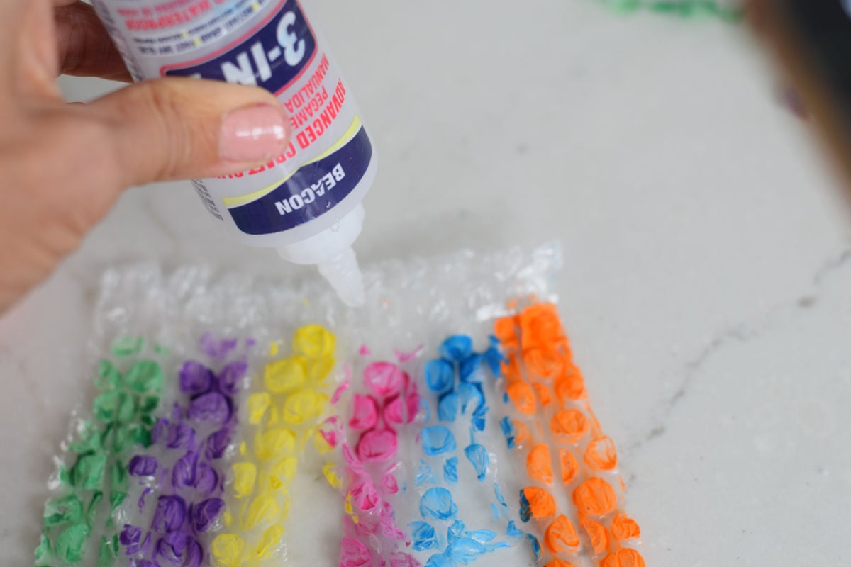 adding glue to bubble wrap