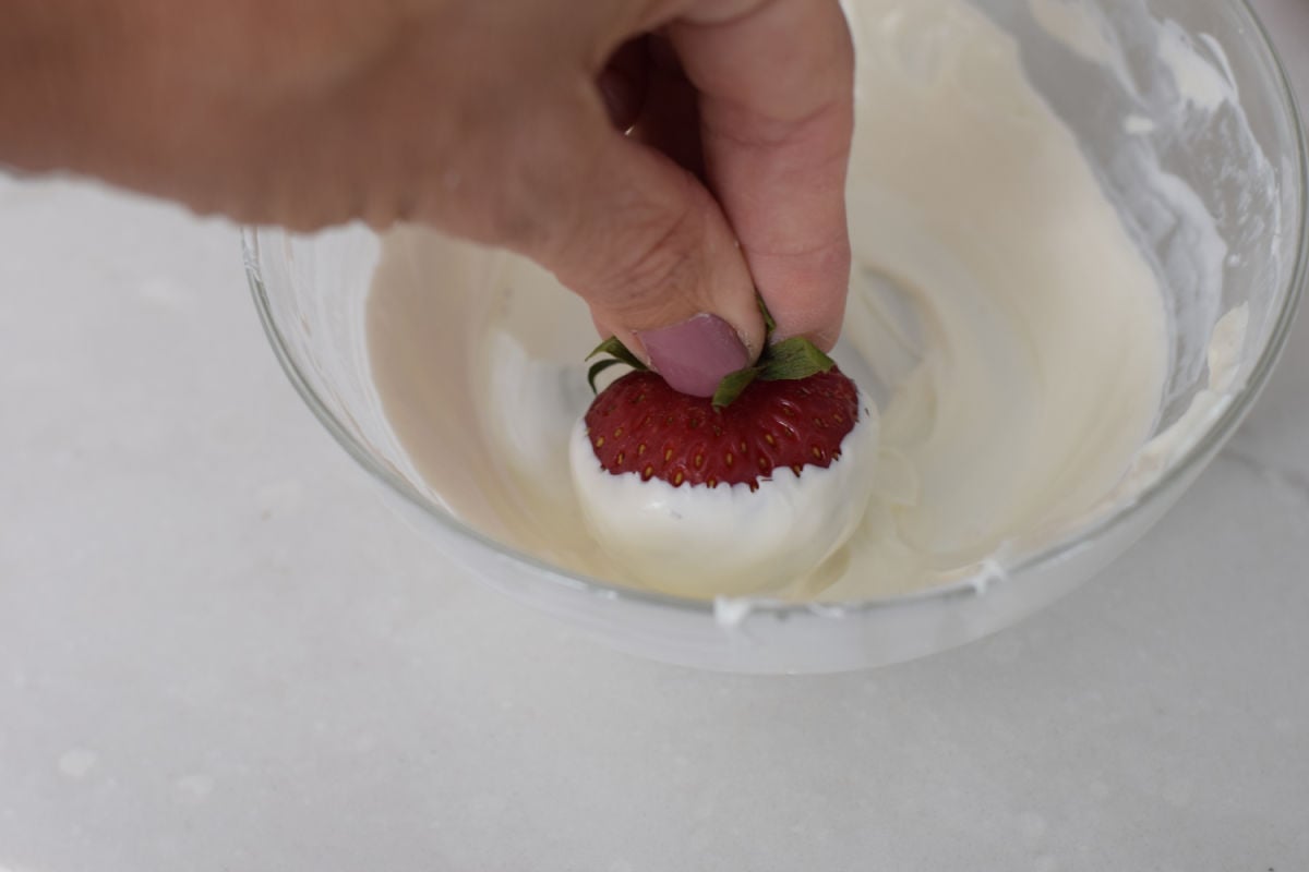 dipping strawberries in white chocolate
