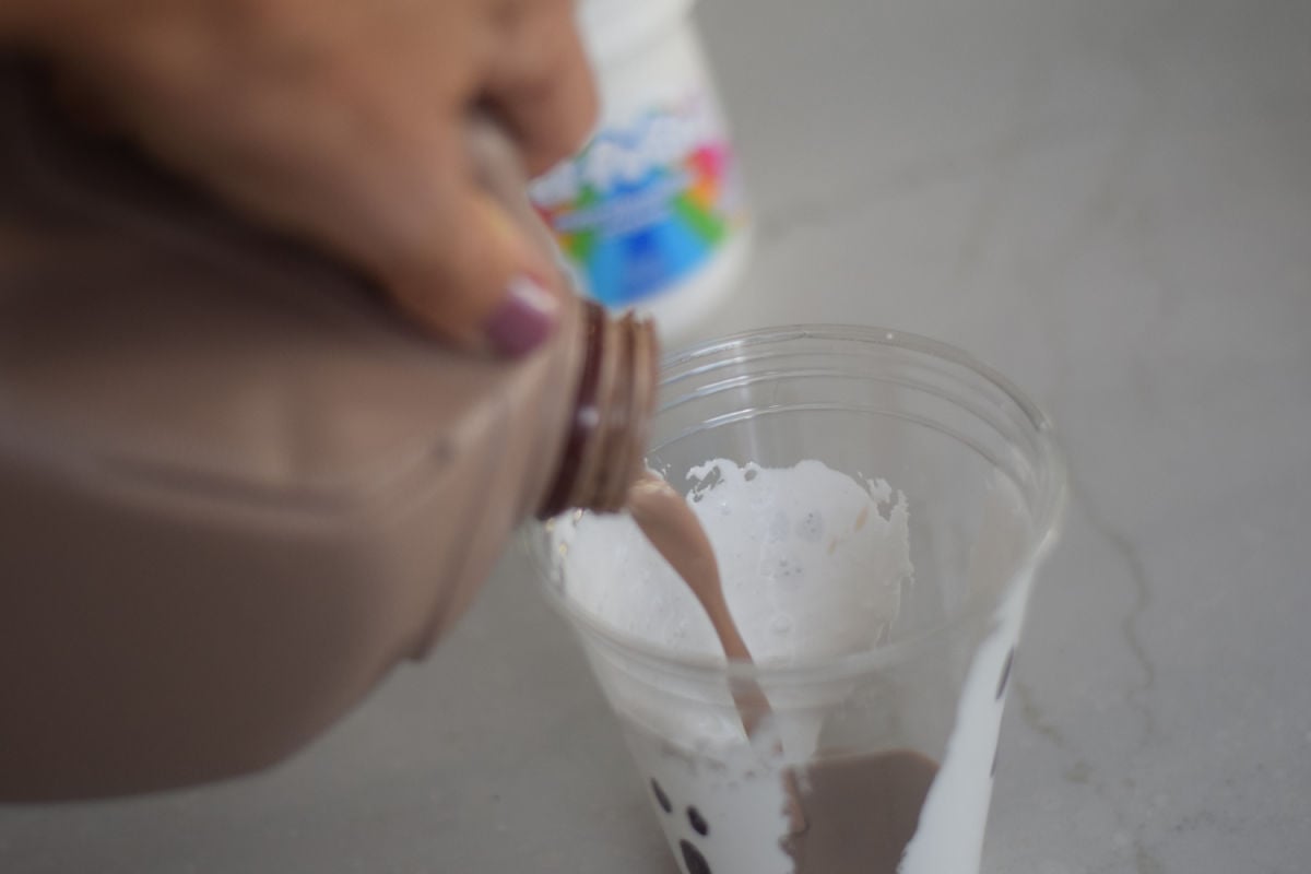 pouring milk into ghost cups 