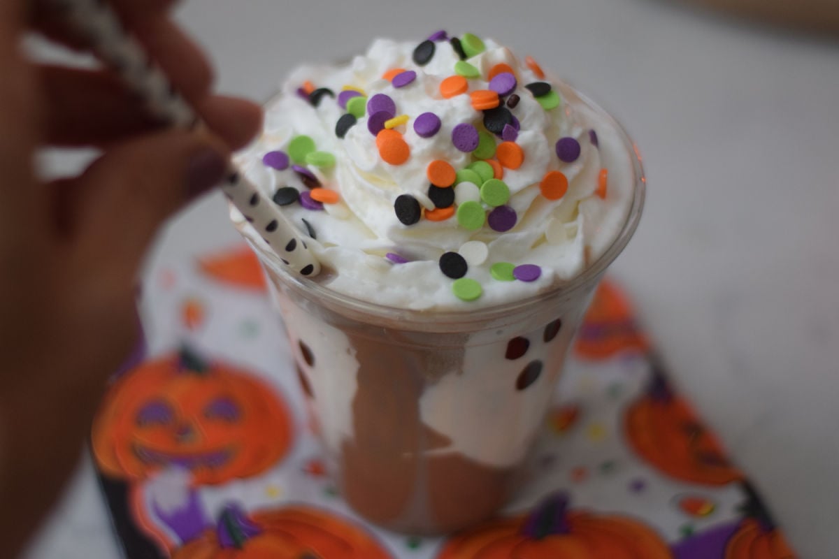 adding straw to ghost milk cup