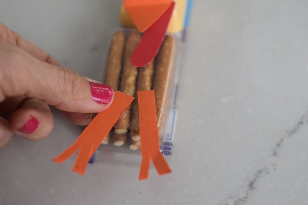 gluing legs on turkey snack