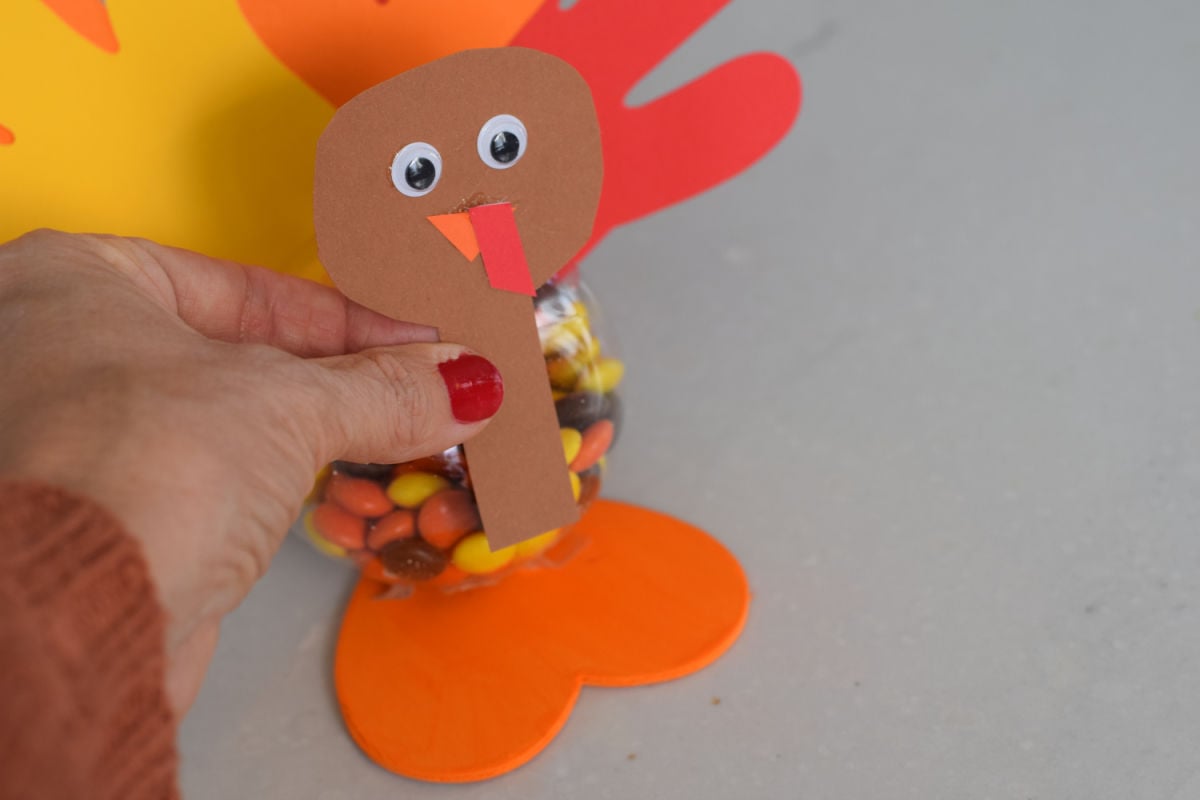 gluing head to turkey handprint craft