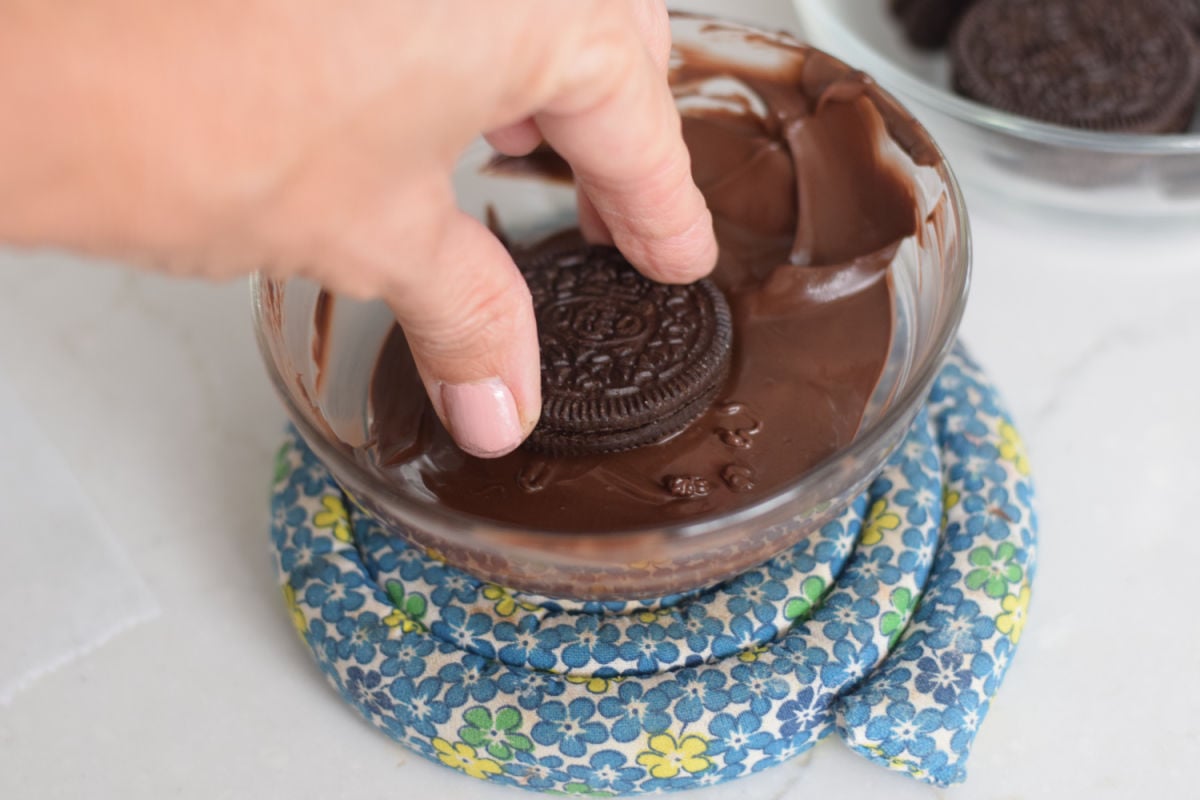 dipping Oreo in chocolate