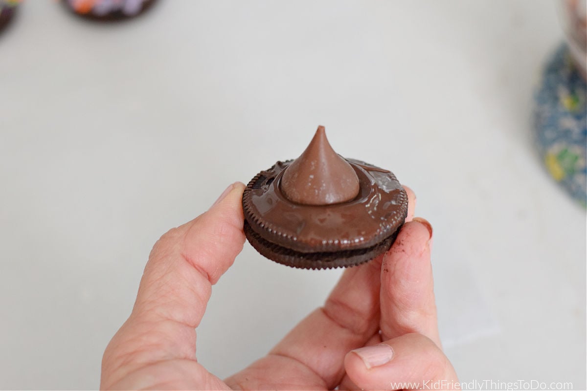 making Oreo witch hat cookies