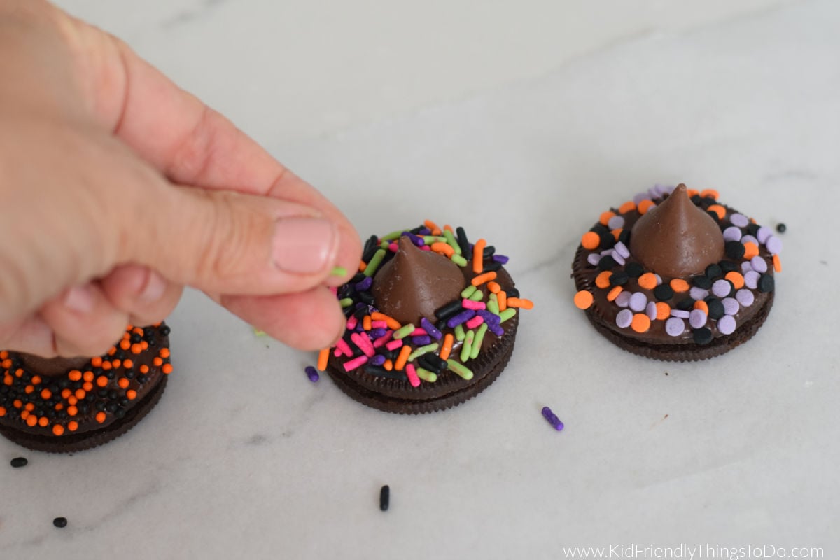 decorating witch hat cookies