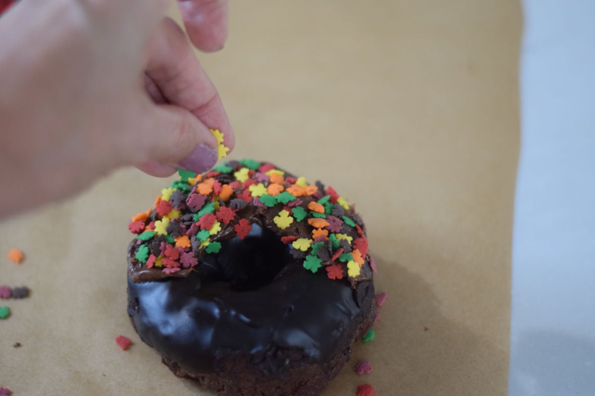sprinkling chocolate donuts