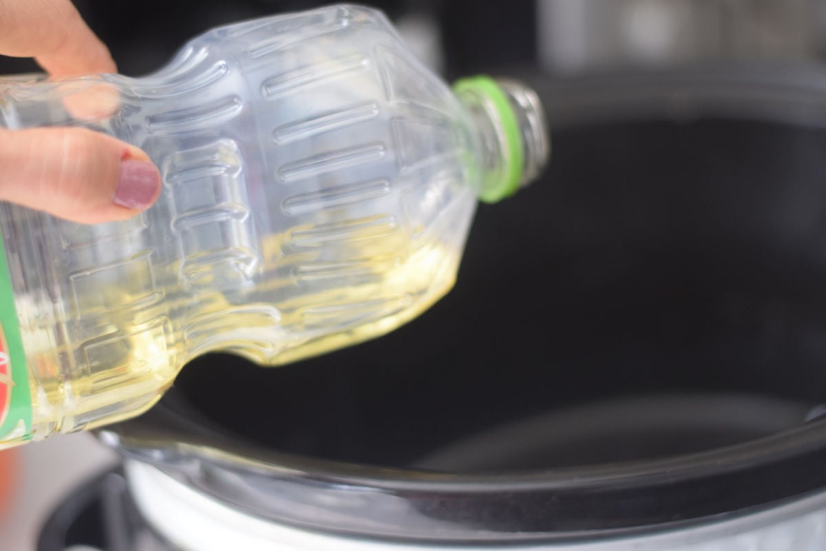 adding oil to slow cooker