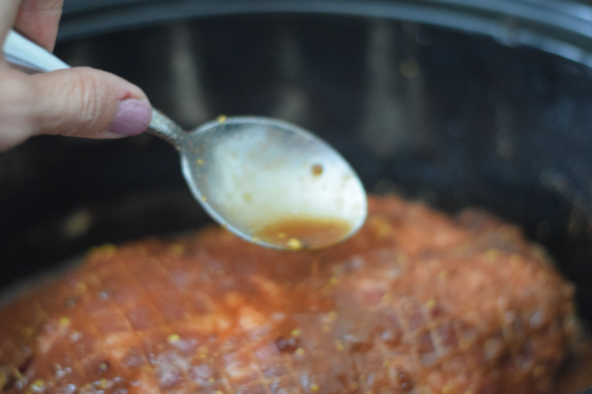 spooning sauce over roast