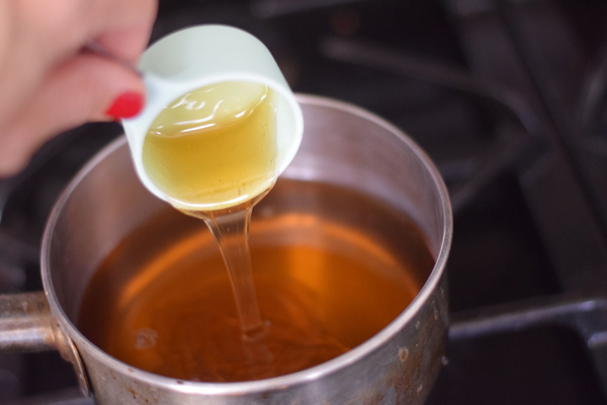 adding honey to pan