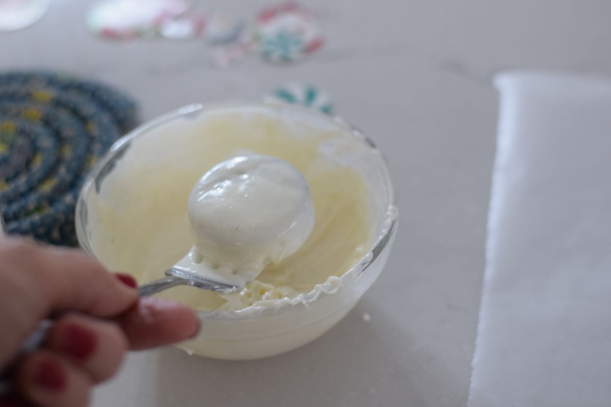 dipping Oreo cookies in white chocolate 