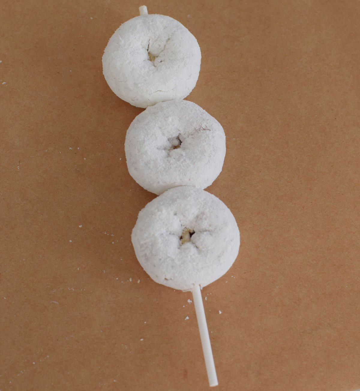 mini powdered donuts skewered 