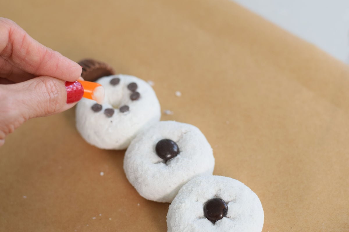 adding nose to snowman donut