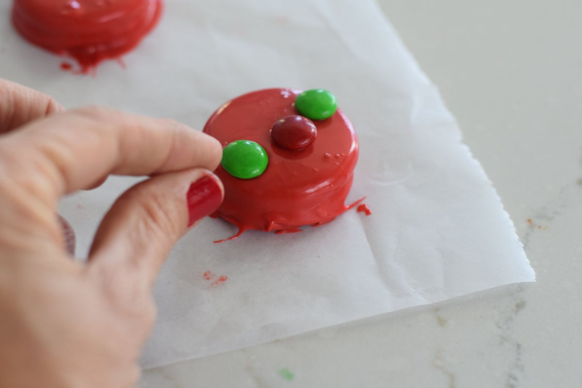 adding candy to dipped Oreos 