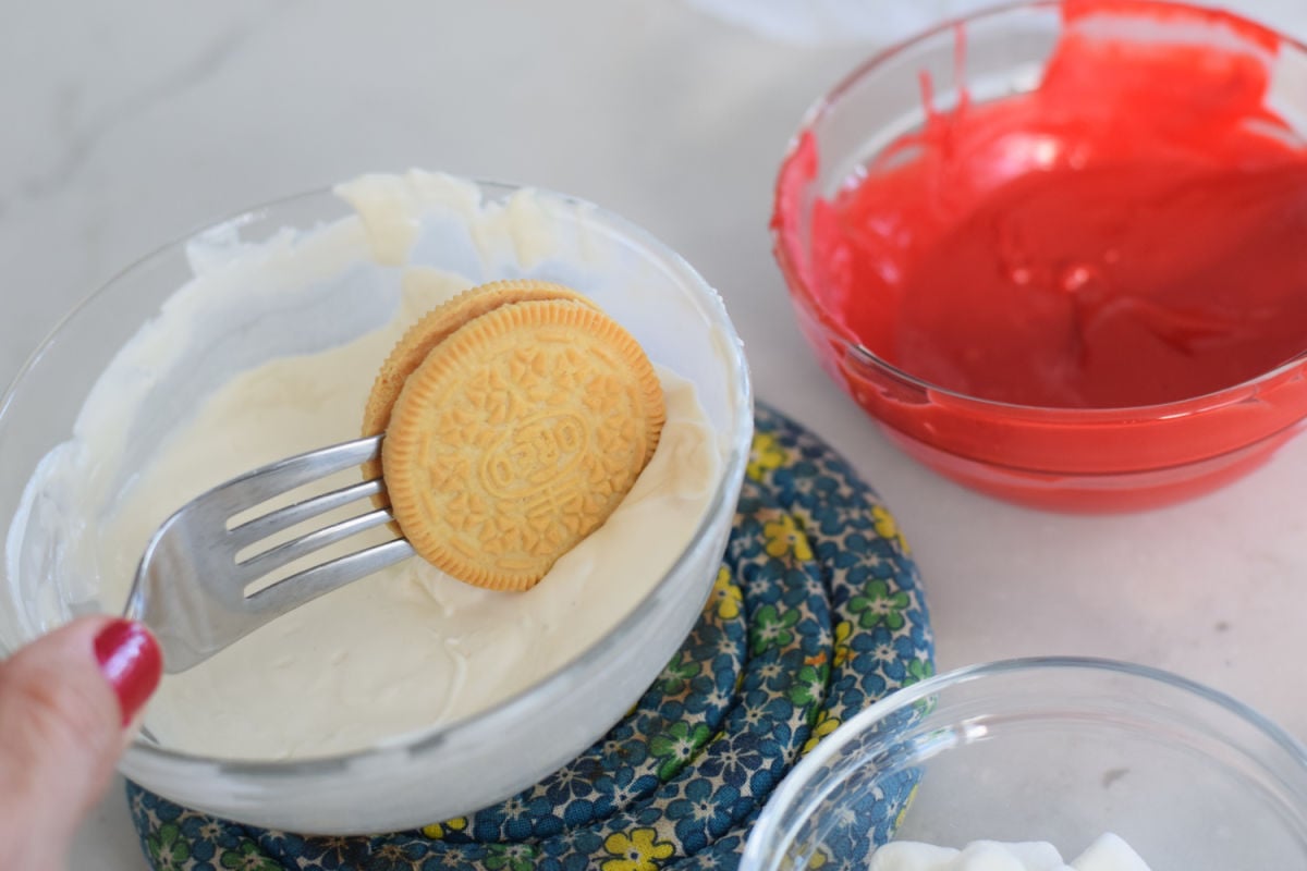dipping Oreo cookies into chocolate