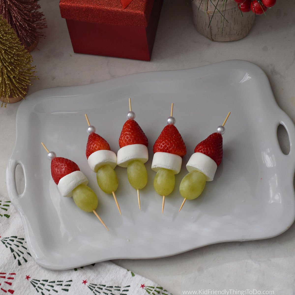Grinch fruit skewers on platter 