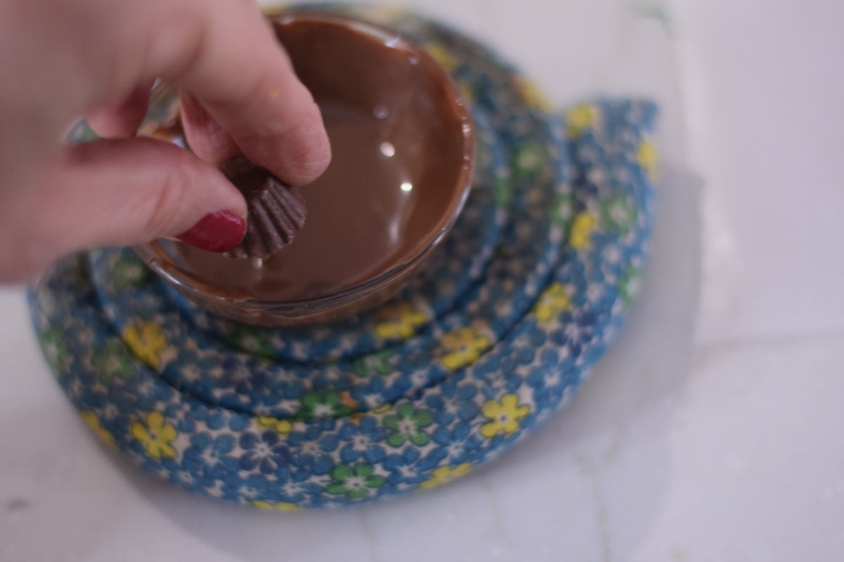 dipping Reese's into chocolate