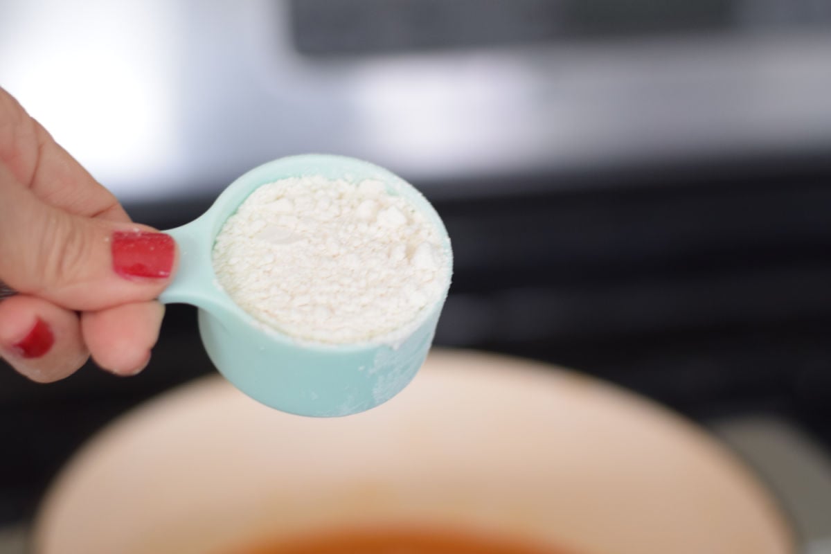 adding flour to soup