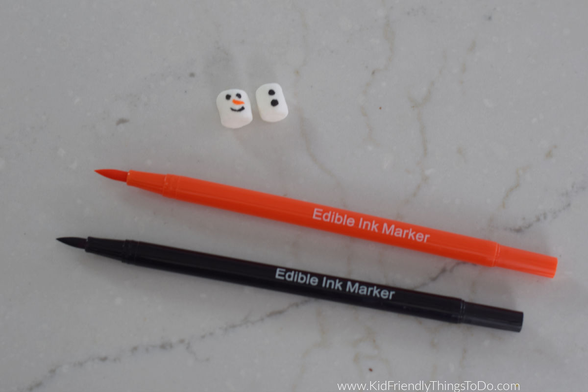 making marshmallow snowman with edible markers