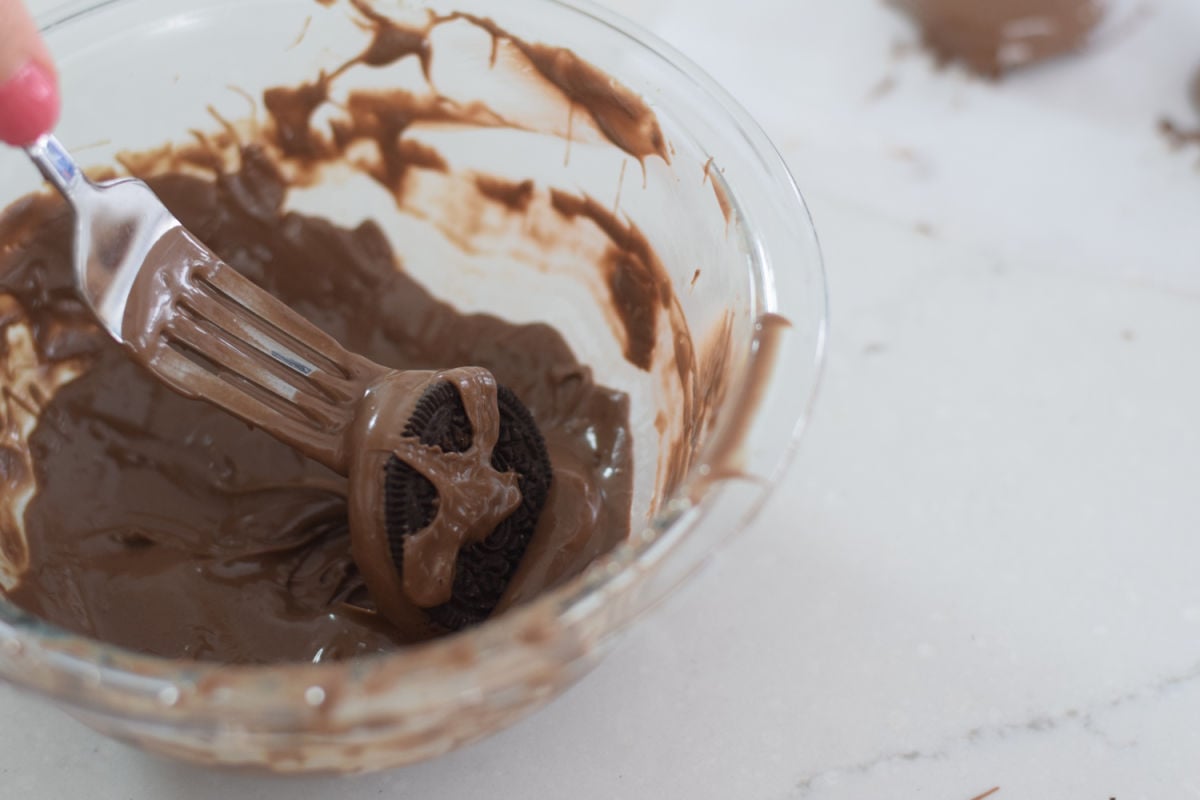 dipping Oreos in chocolate 