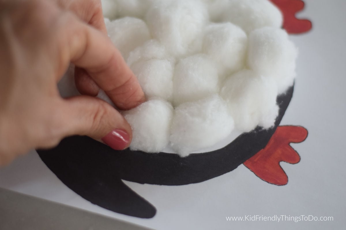 adding cotton to penguin craft