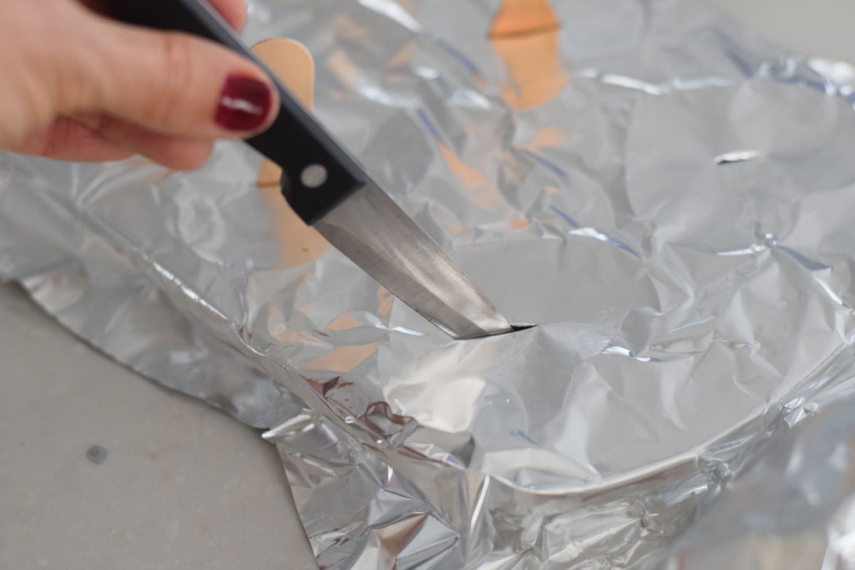 slitting foil to make ice cube pops 