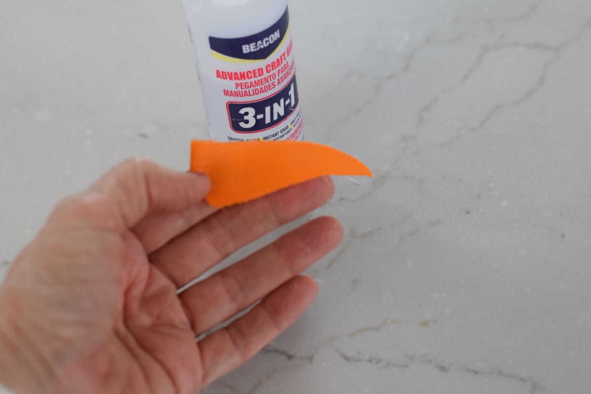 adding fabric nose to snowman buddy