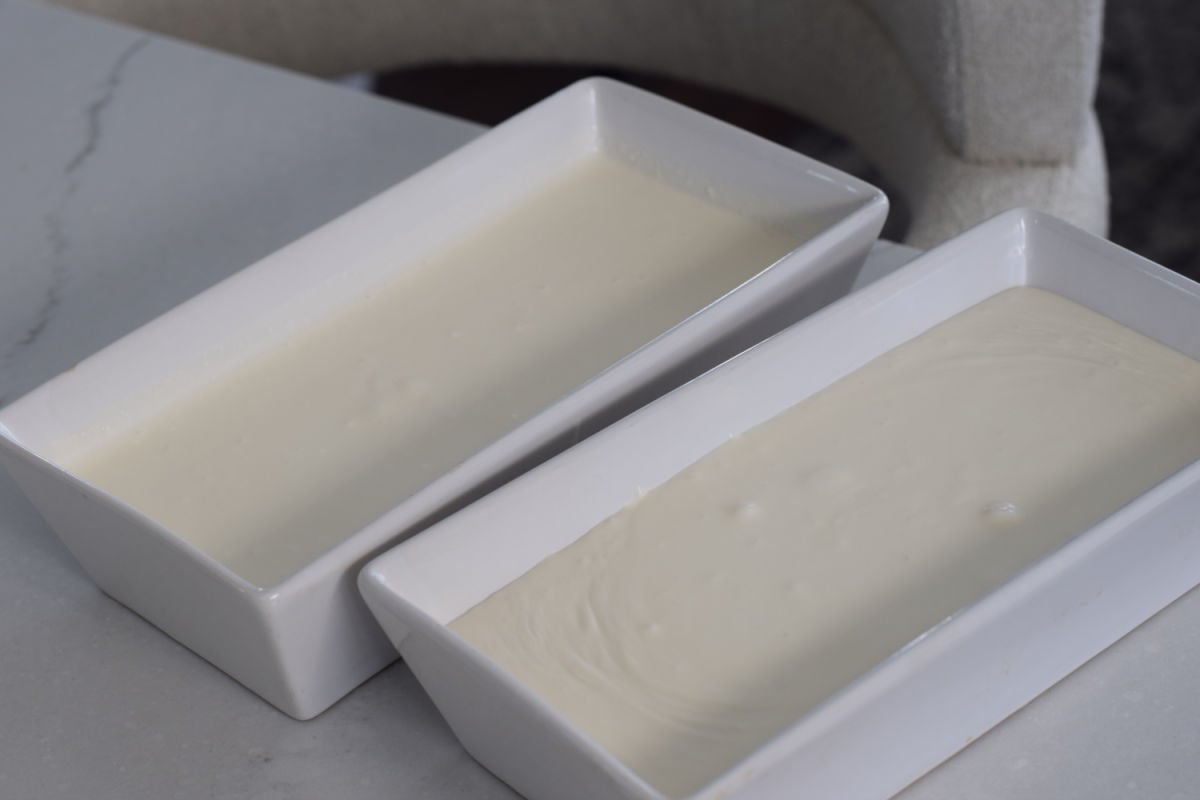vanilla ice cream poured into loaf pans 