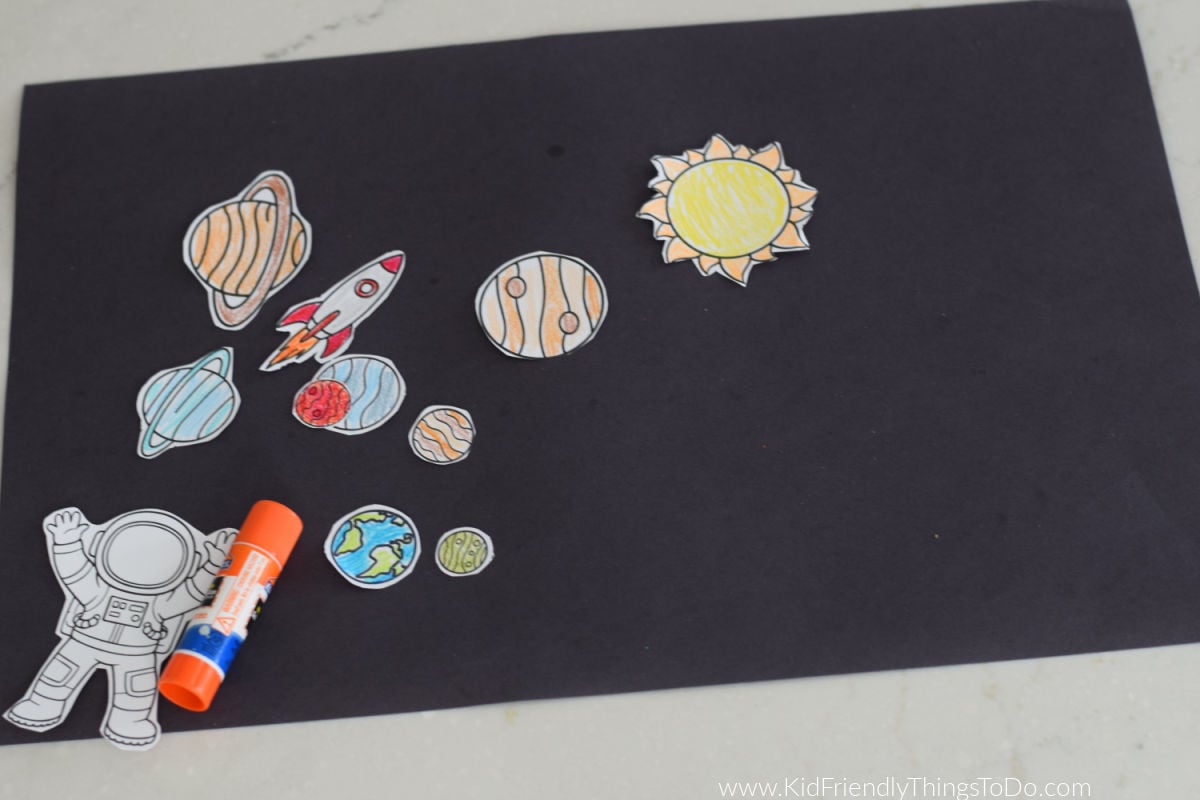 gluing planets onto paper 