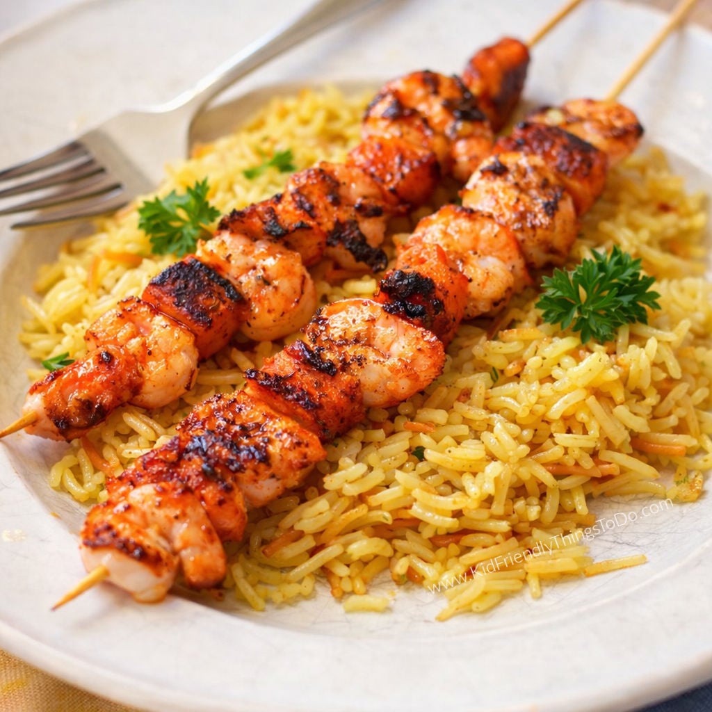 grilled shrimp and sweet potato skewers on rice