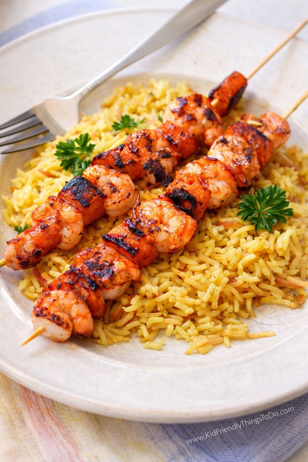 grilled shrimp and sweet potato skewers on rice 