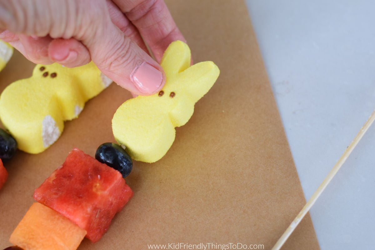 making Easter Peeps fruit skewers 