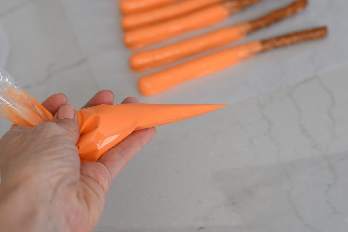 piping bag filled with orange chocolate