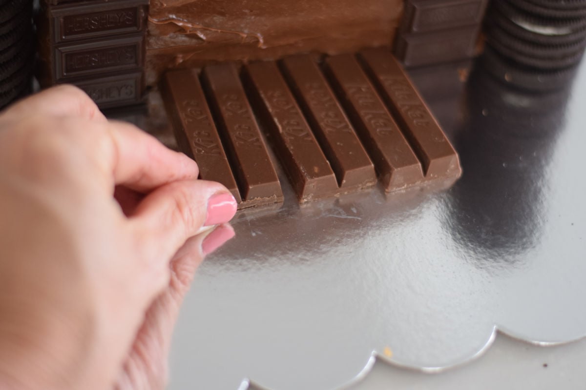 making a kit-kat drawbridge on castle cake