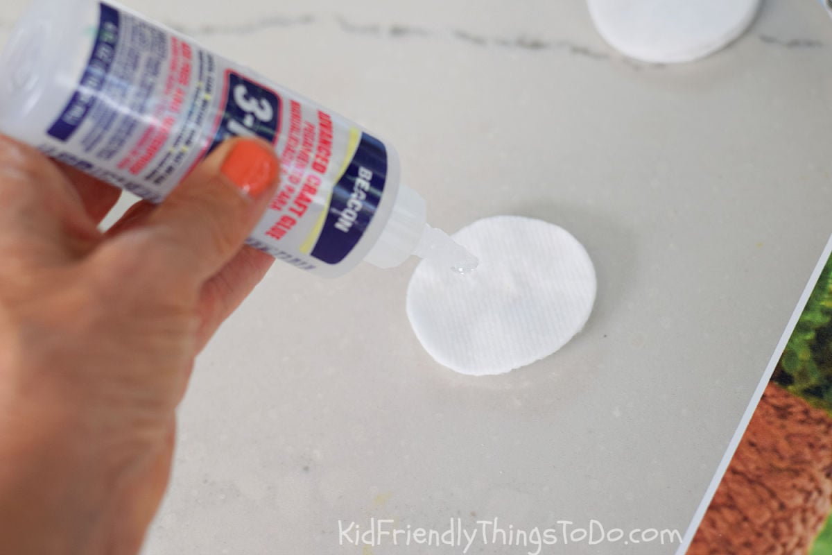 adding glue to cotton rounds for wings of bee craft 