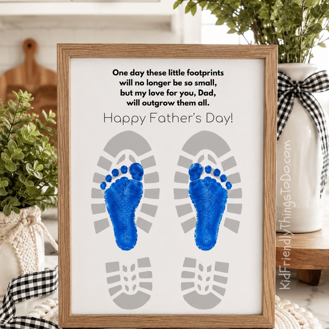 Framed Father’s Day footprint keepsake printable displayed on a kitchen counter with greenery, gingham ribbon, and farmhouse-style decor.