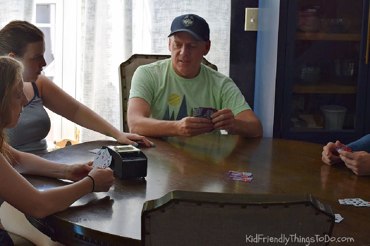 family playing Go fish with a regular deck of cards 