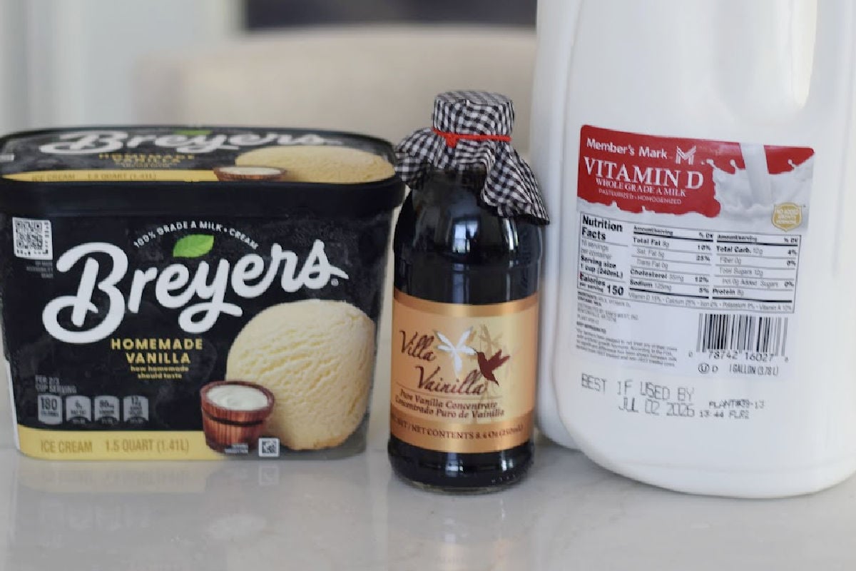 ingredients for a milkshake recipe including milk ice cream and vanilla