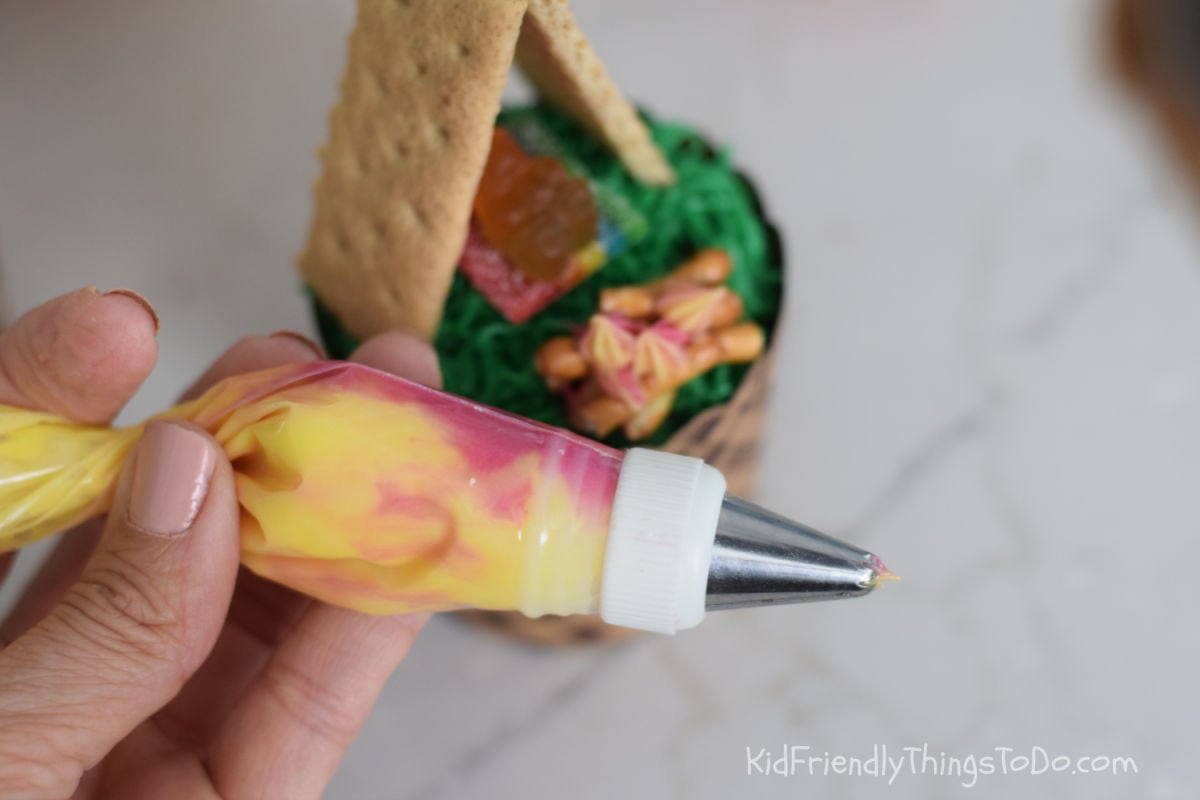 red and yellow frosting in piping bag