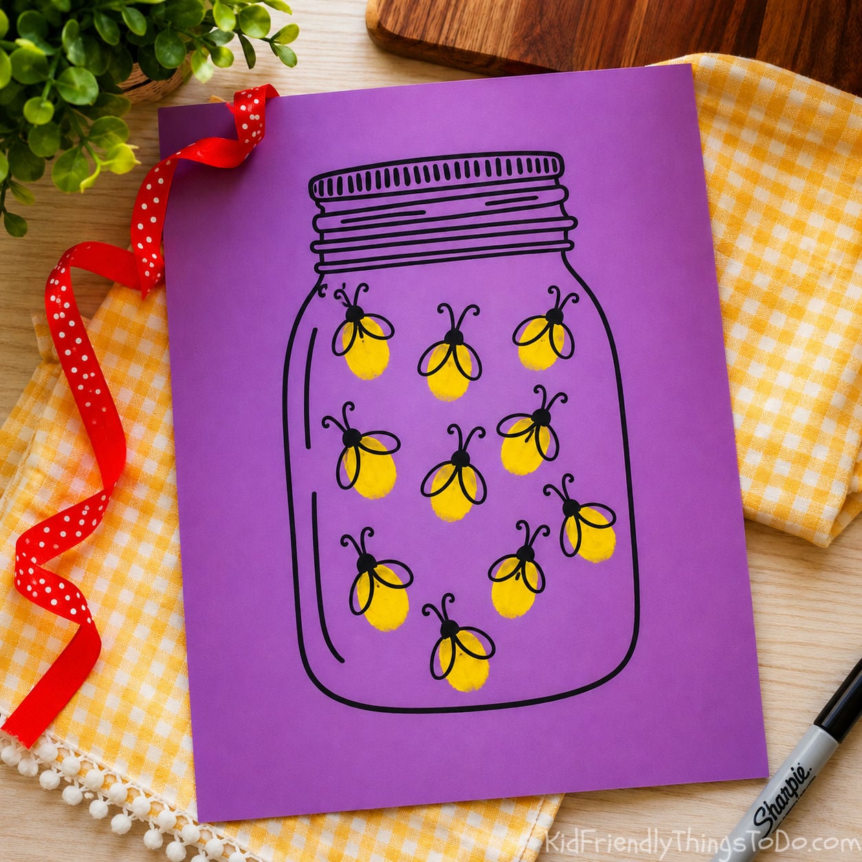 lightning bug craft printable with thumbprint fireflies inside a mason jar on purple cardstock