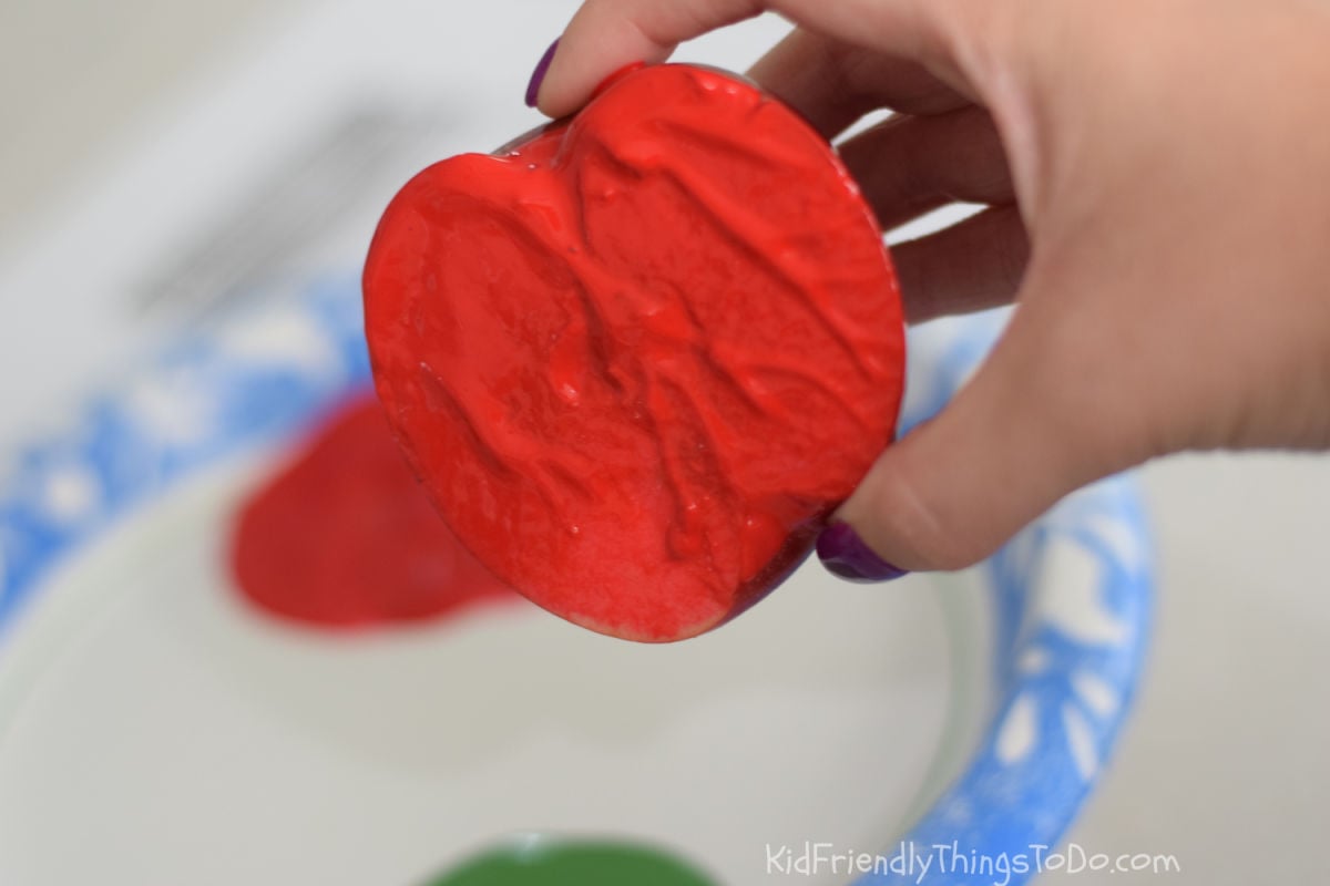 apple with red paint for apple stamping 