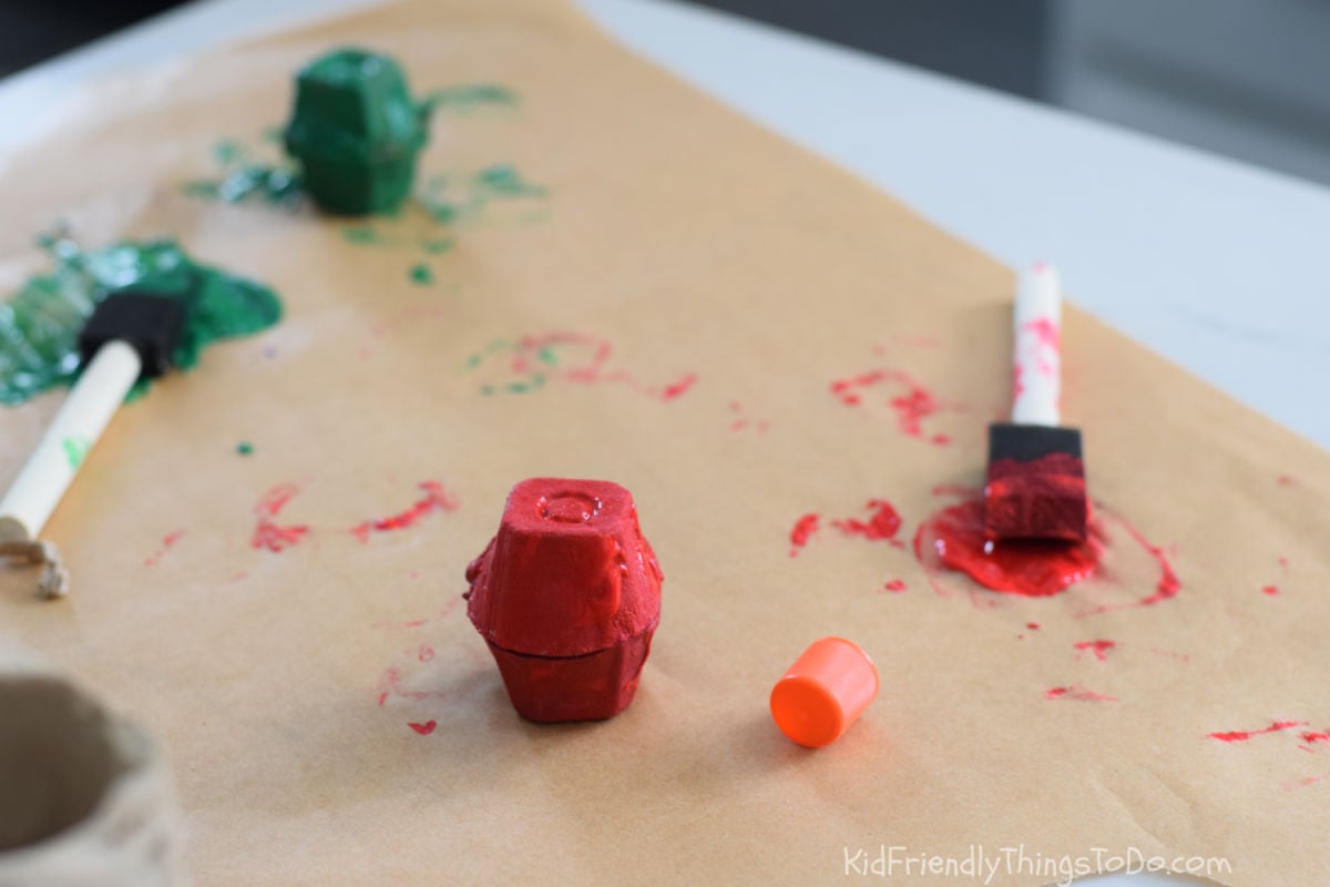 gluing egg cartons together for an apple egg carton craft 