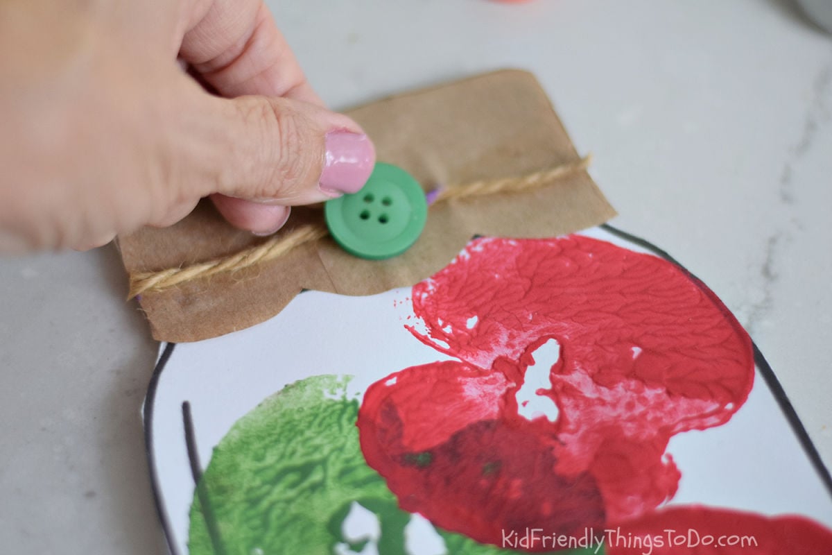 adding decoration to the mason jar apple stamp craft 