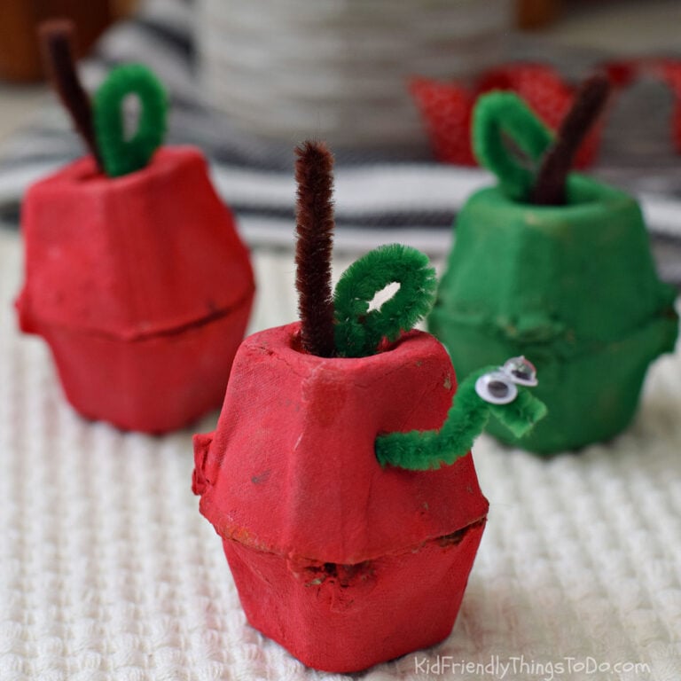 Egg carton apple craft for kids with a pipe cleaner worm, stem, and leaf