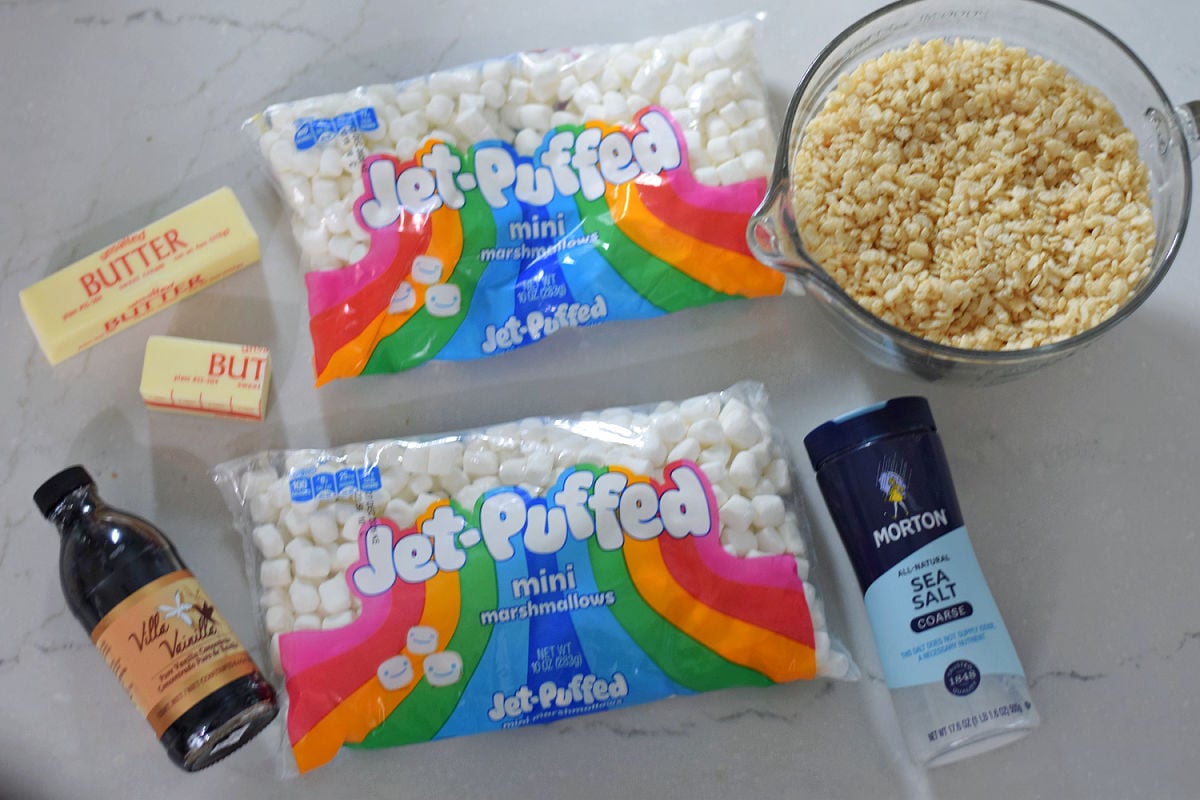 Ingredients for homemade Rice Krispie Treats including cereal marshmallows butter vanilla and salt