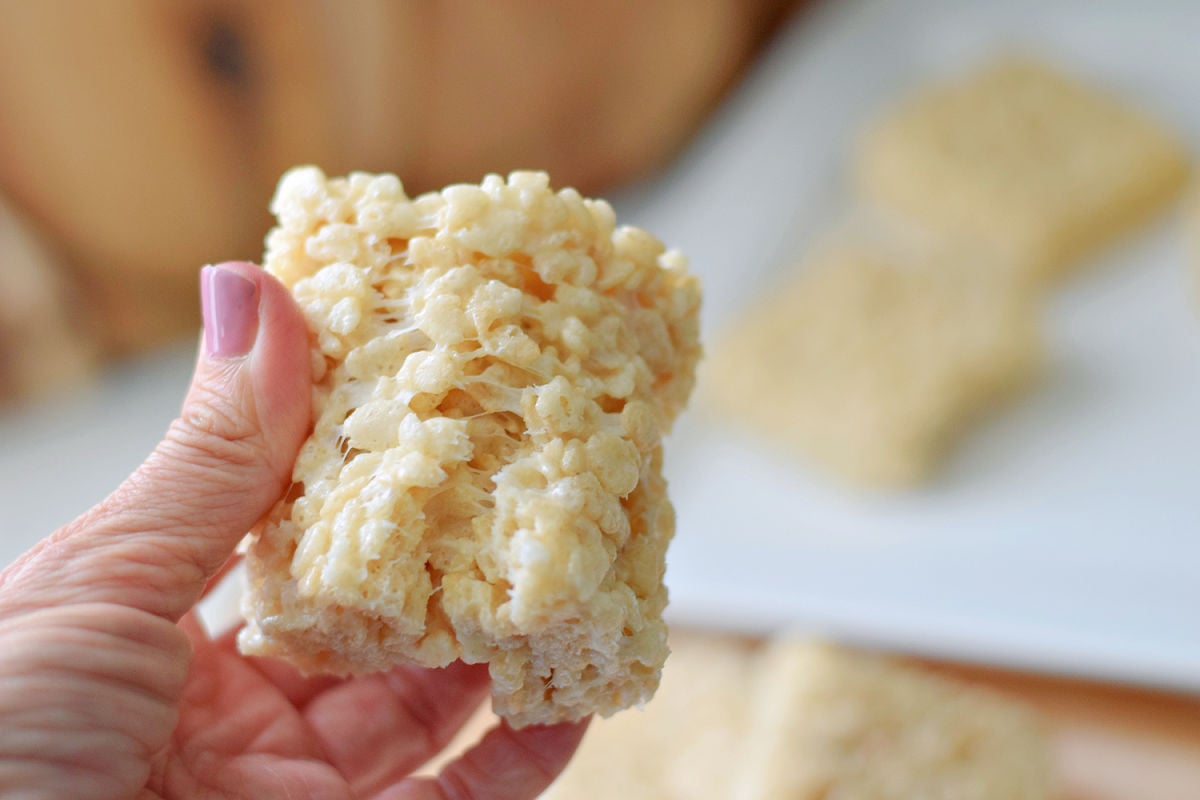 Soft Rice Krispie Treat held up to show gooey marshmallow texture