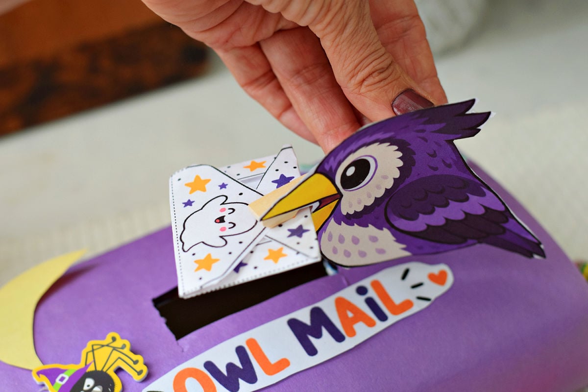 Clothespin owl delivering a printable Halloween envelope into a purple Owl Mail mailbox.